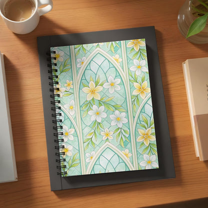 Spiral notebook with a mint green floral stained glass design.