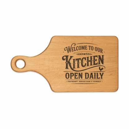 Wooden cutting board with "Welcome to Our Kitchen Open Daily" text and rooster graphic.