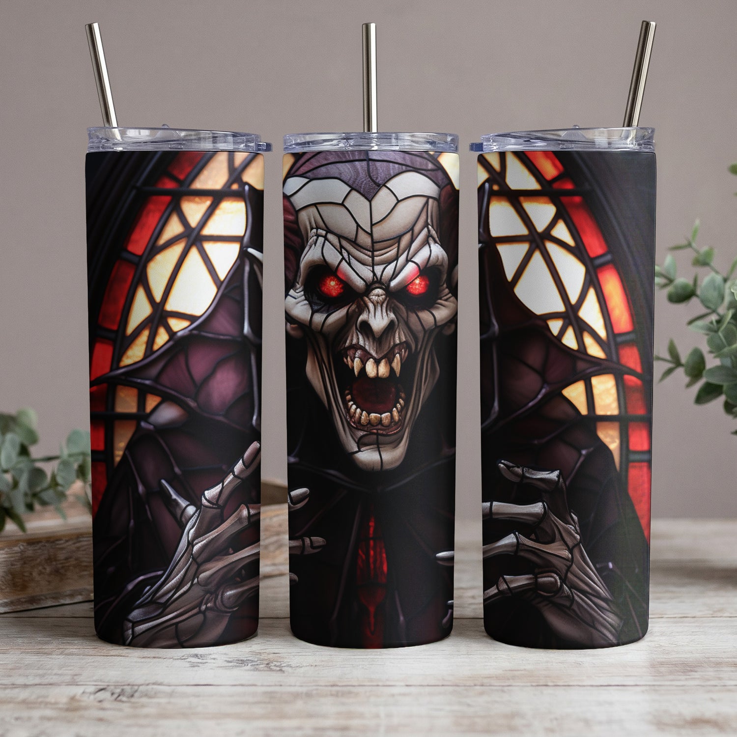 Three tumblers featuring a detailed illustration of a monstrous vampire with glowing red eyes.