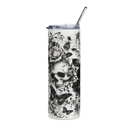 White tumbler with black skull, rose, and butterfly graphic, with a metal straw.