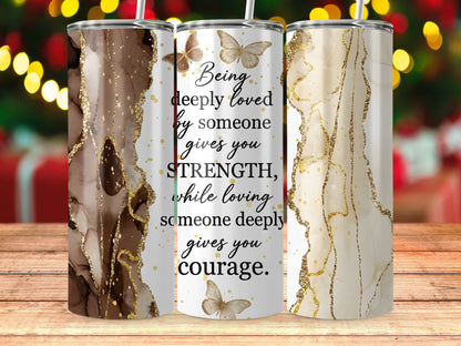 Three tumblers with marbled brown, white, and gold designs, one featuring inspirational text.