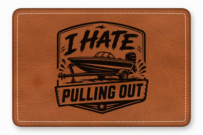 Brown faux leather rectangular patch with white stitched border and black engraved motorboat graphic and text.