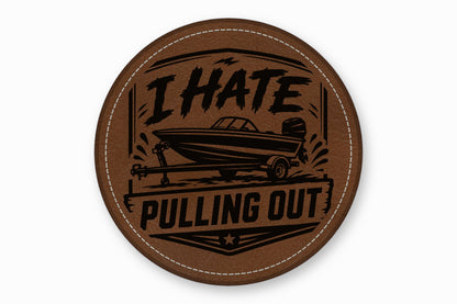 Round brown leather patch with white stitching featuring a motorboat graphic and text reading I HATE PULLING OUT.