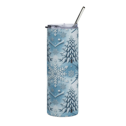 Tall tumbler with lid and straw, featuring a blue and white snowflake and pine tree pattern.