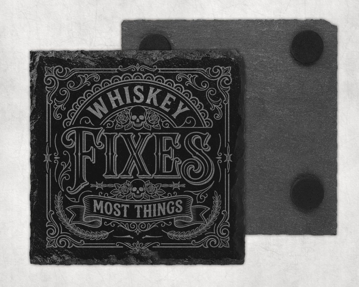 Slate coaster with "Whiskey Fixes Most Things" text and skull graphic.