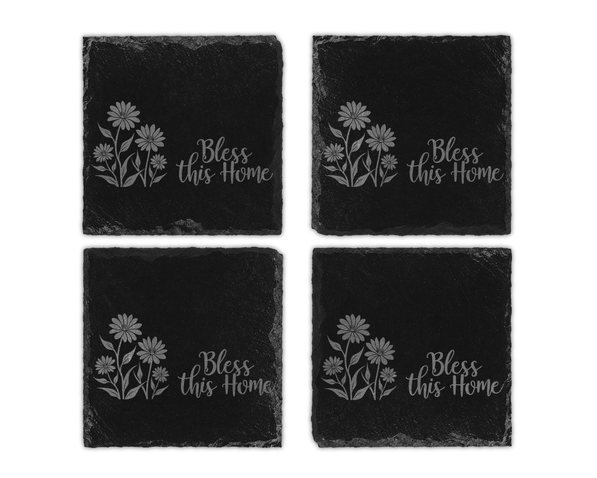 Four black slate coasters etched with flowers and "Bless this Home".