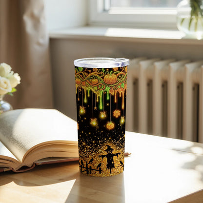 Tumbler with Halloween design featuring pumpkins, scarecrow, and fireflies on a black and gold glitter background.