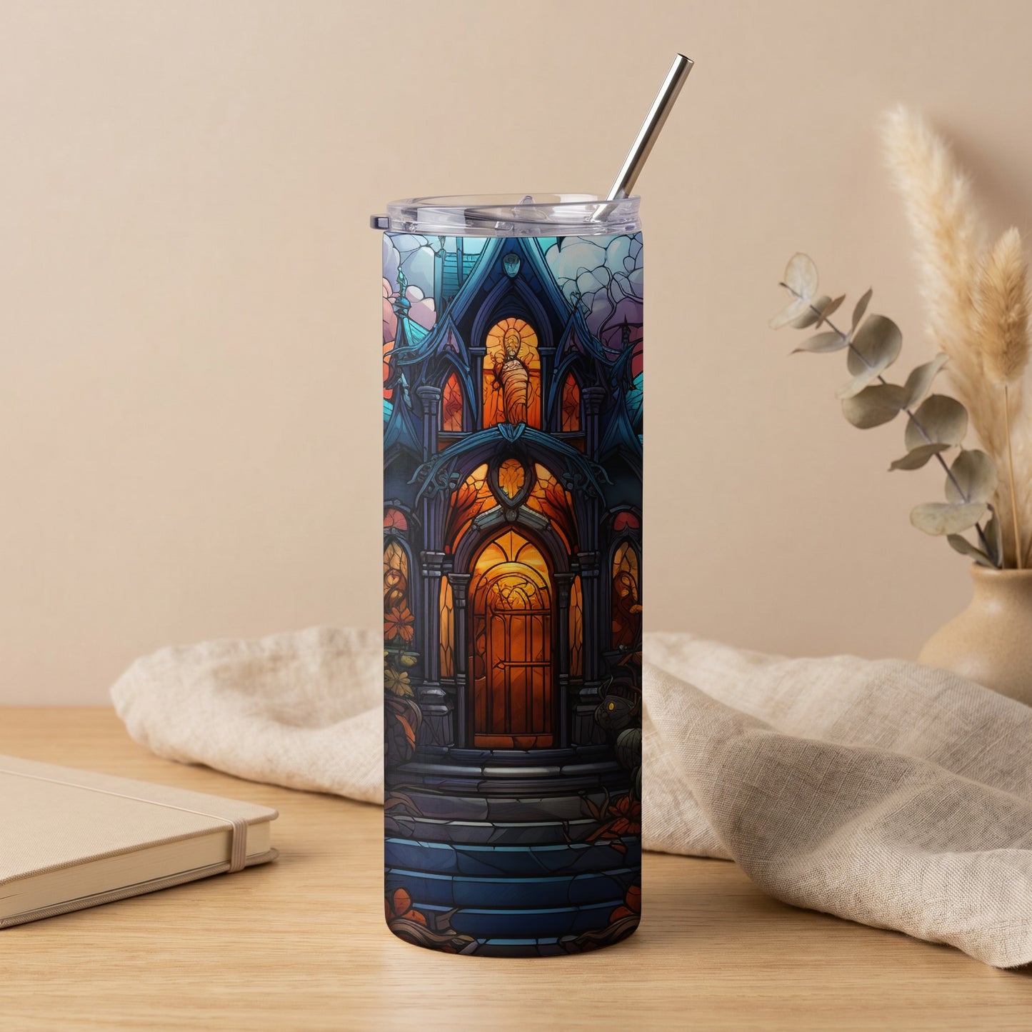 Tumbler with stained glass art of a gothic entryway with orange lighting.