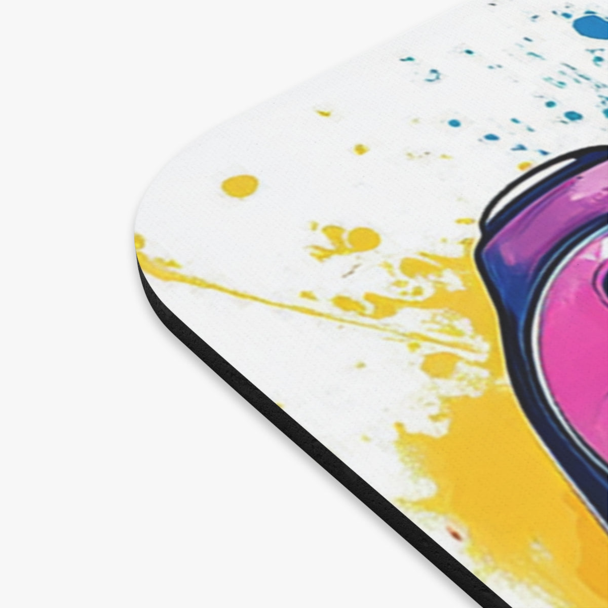 Mousepad with abstract pink, blue, and yellow paint splatters.