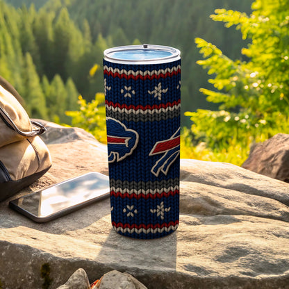 Buffalo Bills tumbler with knit pattern and logos on a rock with a phone.