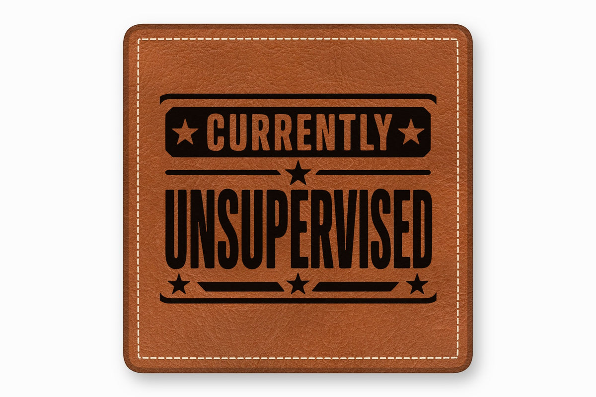 Brown leather square patch with white stitching and the black text currently unsupervised with stars.