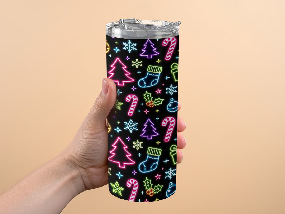 Tumbler with black background and neon Christmas icons: trees, stockings, candy canes, snowflakes, gifts, and ornaments.
